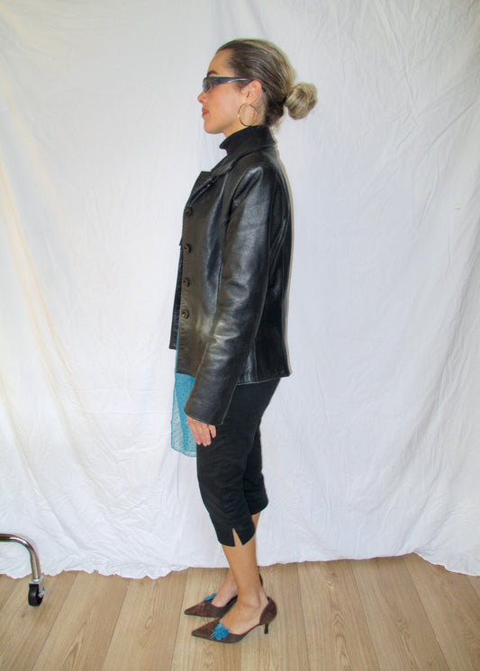 black leather blazer black capri trousers 2yk suede kitten heels with blue vintage details and ysl glasses