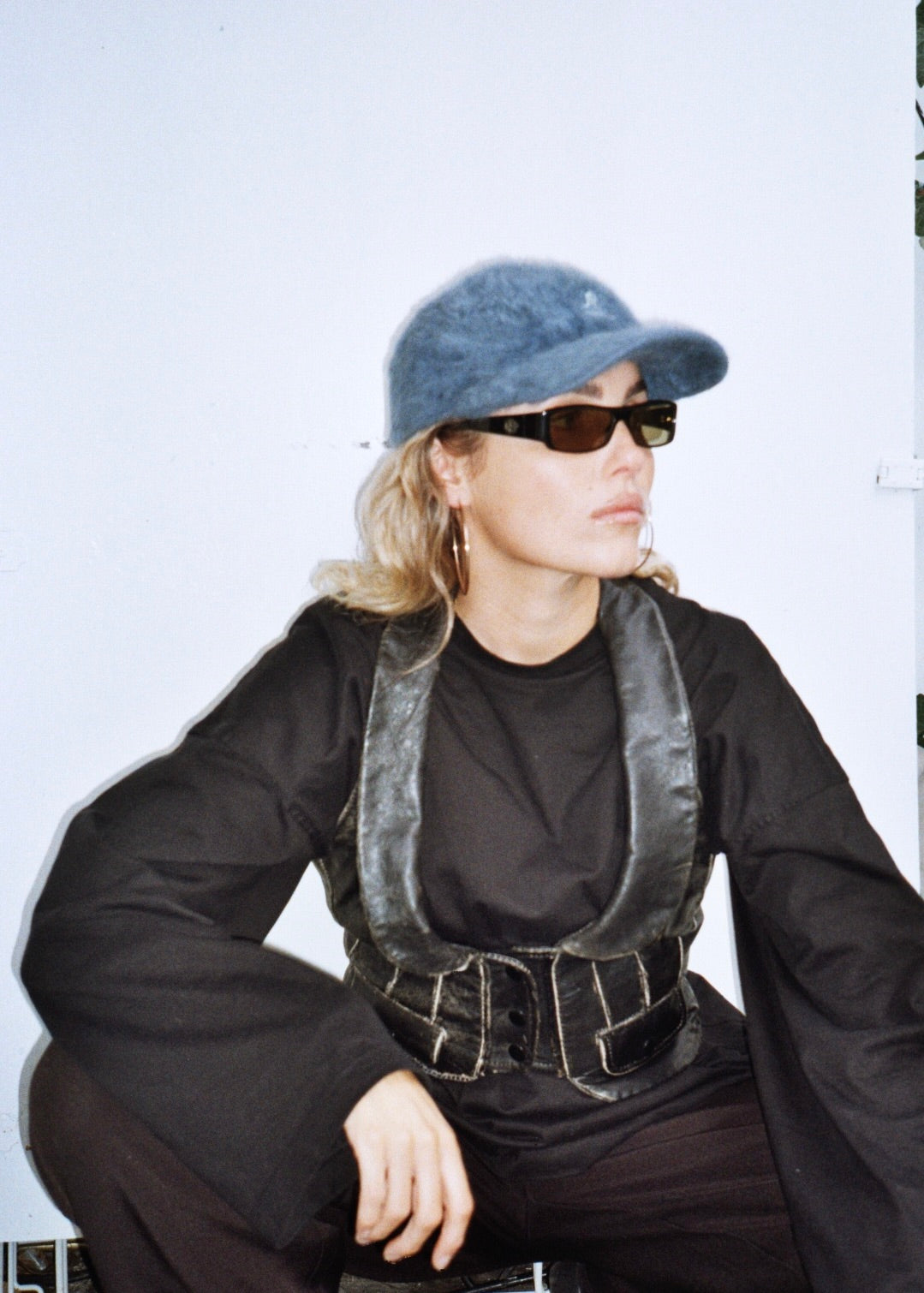KANGOL ANGORA CAP fuzzy baseball cap on model analog with gucci sunglasses leather waistcoat oversized black outfit
