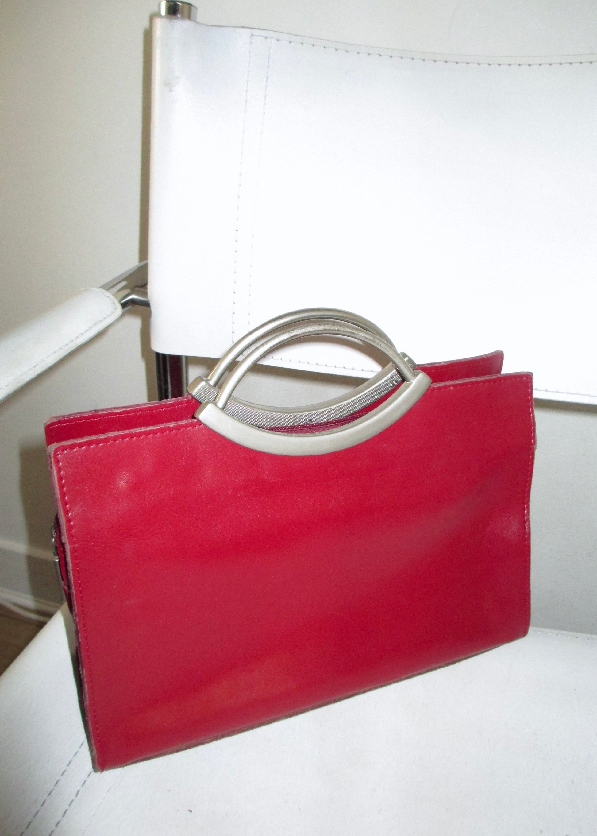 RED LEATHER BAG close up bauhaus chair vintage chrome metal