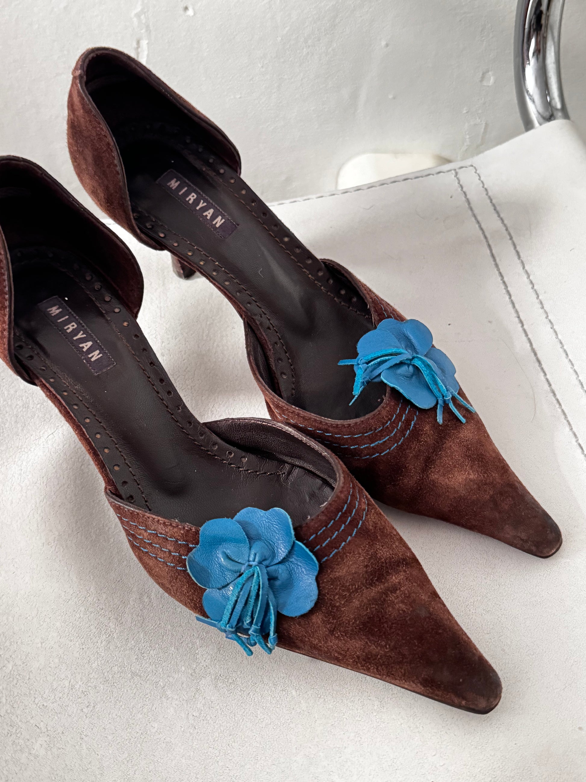 Vintage suede kitten heel with blue leather flower close up