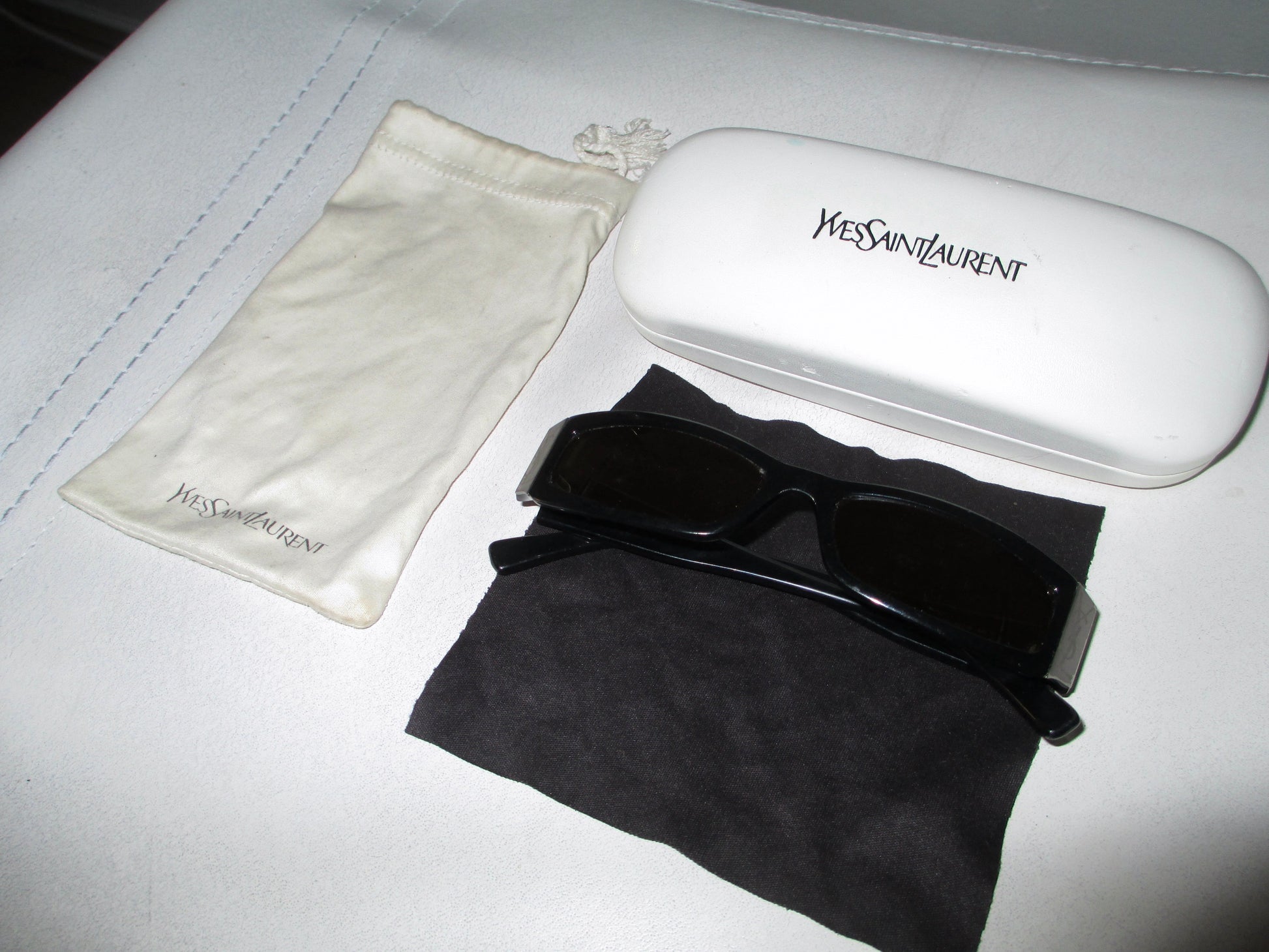 YSL  designerSUNGLASSES with pouch and case close up