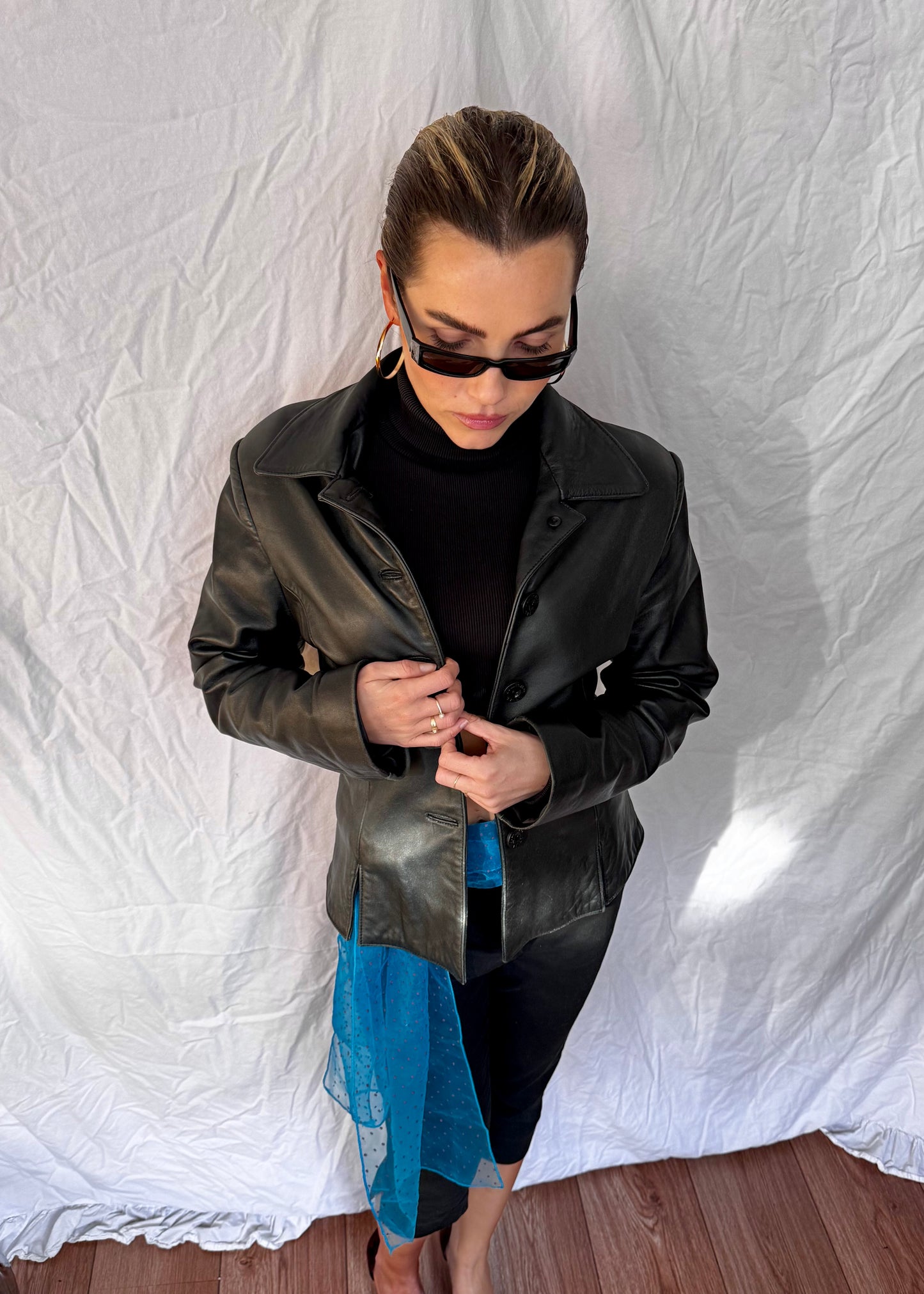black leather blazer black capri trousers 2yk suede kitten heels with blue vintage details and ysl glasses close p
