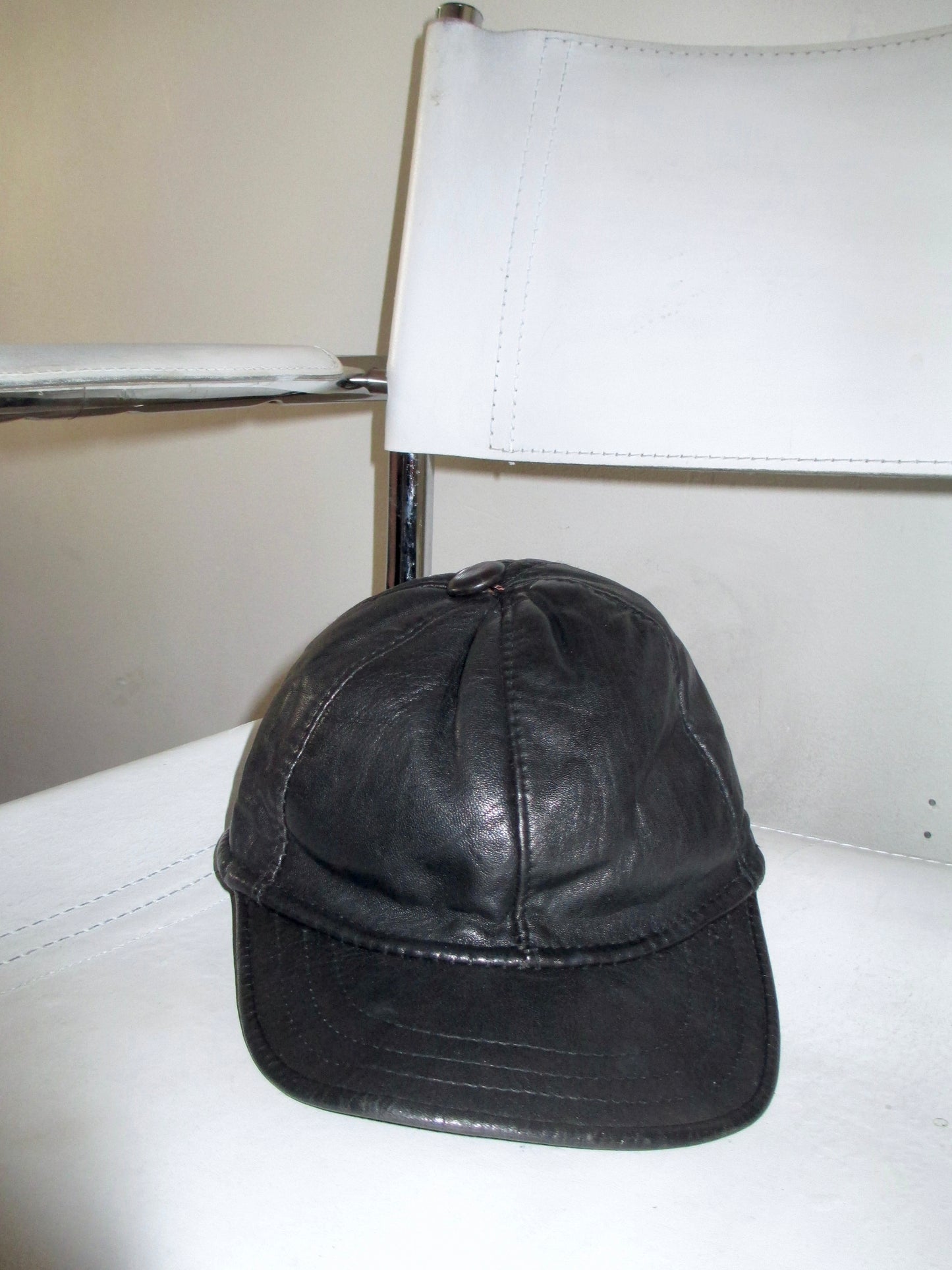 leather vintage cap close up on bauhaus chair