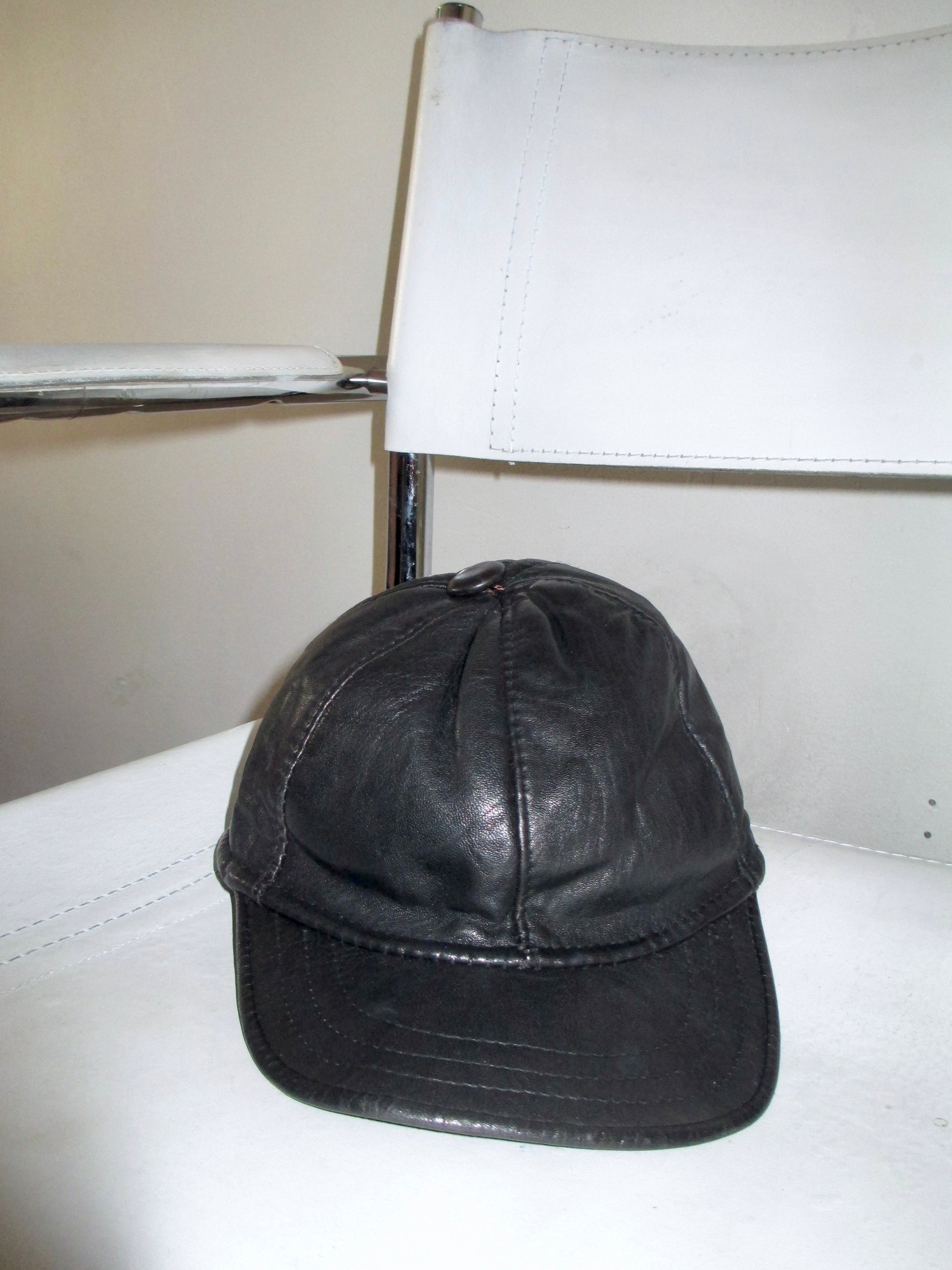 leather vintage cap close up on bauhaus chair