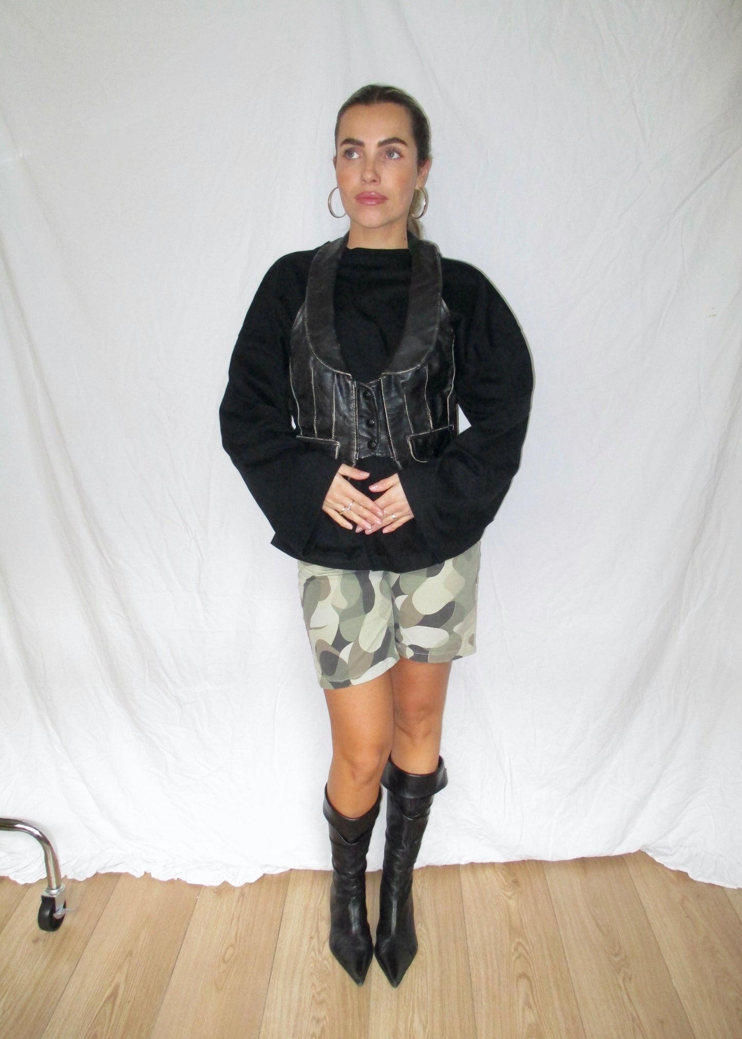 leather vintage waistcoat corset crop top with army shorts and vintage leather boots