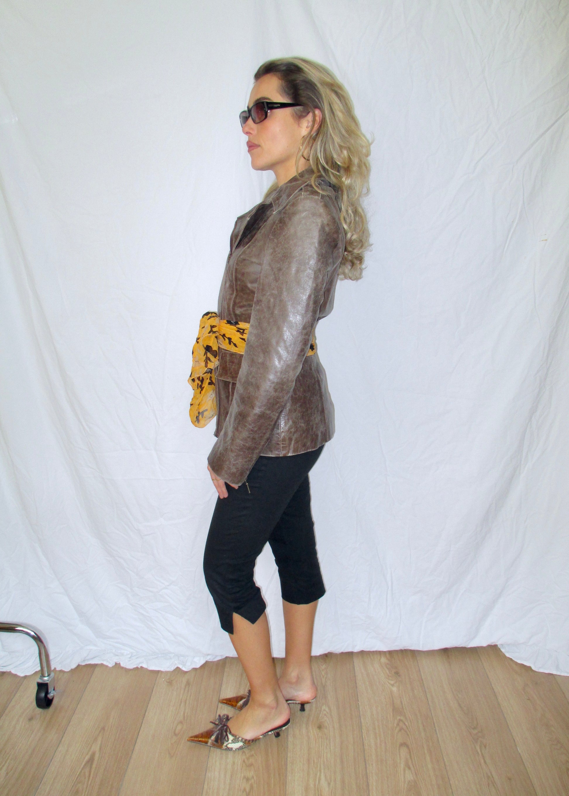 Side split capri pants brown leather jacket belt scarf vintage tiger leather kitten heels 2yk outfit prada sunglasses